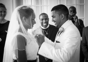 Groom Lifting Bride's Veil